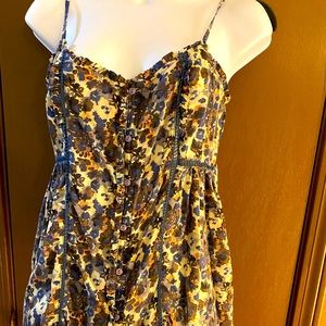 Spaghetti strap floral tank top with buttons all the way down